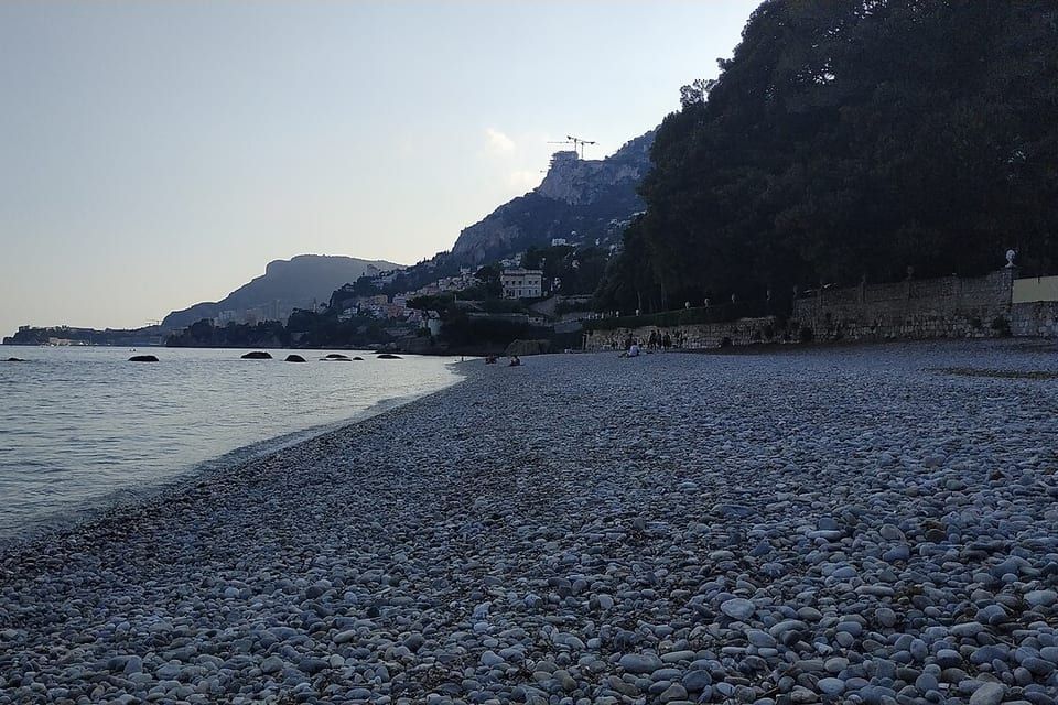 Pebble beach of Golfe Bleu in Roquebrune-Cap-Martin, at the foot of the village